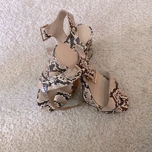 Like brand new. Just wear once. Snake skin